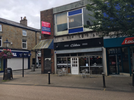 The property comprises a ground floor retail unit located at the end of a modern shopping. Internally the accommodation is divided to form a ground floor sales area with rear storage/staff accommodation. 

 Externally to the rear of the property ther...