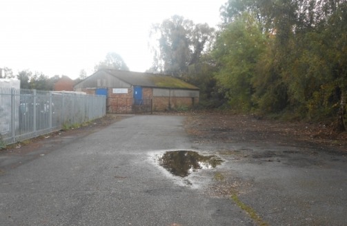 The property comprises a detached industrial unit on a site of approximately 1 acre including a good sized yard, which wraps around the building.<br><br>The building is currently arranged to provide a clear span workshop area with two rear storerooms...