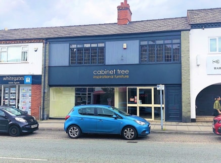 A double fronted retail premises with approx 35 feet roadside frontage and a ground floor sales area extending to 981 sq.ft.