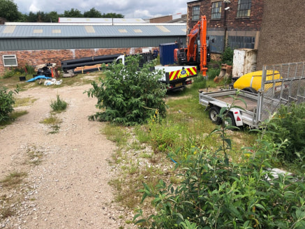 The property comprises a pair of interconnected industrial/warehouse buildings of brick elevations supporting various pitched roof surfaces with open plan working areas together with a rear yard and car parking to the front extending to 0.25 acres.