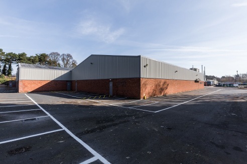 UNIT 2\n\nThe premises provide warehouse of steel portal frame construction with part brickwork / steel clad elevations and profile clad roof incorporating translucent roof lights. The warehouse benefits from 5.4m (17....