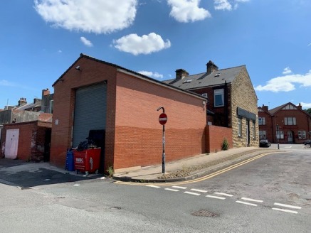 The building comprises an end terrace stone-built retail unit set under a pitched slate roof with retail space at ground floor level and additional accommodation on two upper floors and the basement. There is also a decent sized separate garage build...