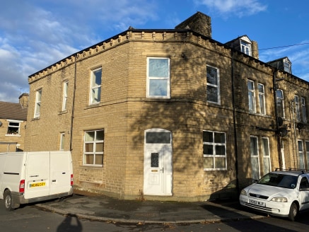 The property is a two storey with attic and basement corner end terrace property under a dual pitched and hipped slate roof. Internally the property has been partitioned to form seven small flats with five benefitting from en-suite shower and toilet...