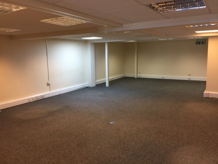 The premises is a middle unit in a terrace of three which are of steel portal frame which has fully insulated cladding and comprises of a factory area and reception office on the ground floor. Whilst the first floor has offices only.