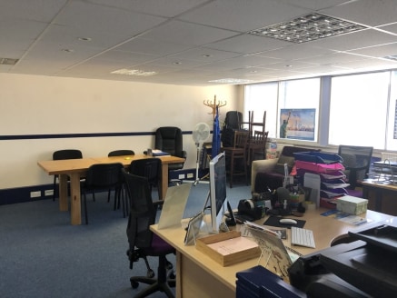 The office is a bright town centre office accessed via a separate staircase leading to both first and second floor offices.

The second floor is open plan with two separate offices and a kitchenette area.