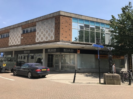 The property comprises an extensive, double fronted shop beneath a pitched slate covered roof offering extensive ground floor, mezzanine and first floor open plan sales areas. 

The accommodation benefits from carpeting, fluorescent lighting, storage...