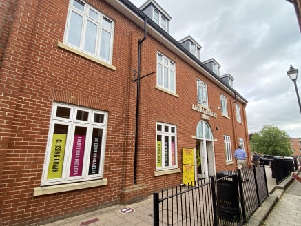 The accommodation comprises a ground floor shop within a modern three storey building of brick construction beneath a pitched roof with flats above.

The shop benefits from double glazed windows and offers a large, open plan sales area, a private off...