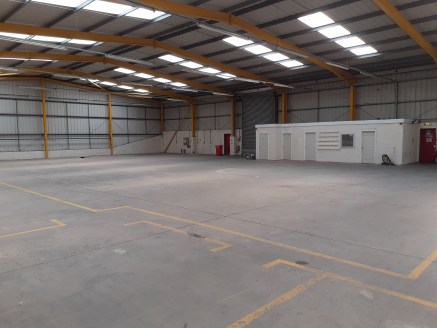 REFURBISHED INDUSTRIAL UNIT WITH PARKING

The unit is an end terrace steel portal frame warehouse with blockwork to dado level and profile sheet cladding above. The roof is of a profile sheet design with circa 15% skylights. Internally the warehouse...