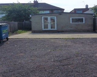 Freehold Investment / development opportunity comprising ground floor commercial unit with studio flat and modern detached outbuilding to the rear with additional land and detached lock up garage. Please note the first floor flat is sold off on a lon...