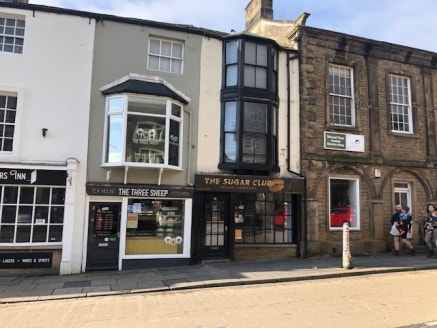 The property comprises an attractive stone built, mid-terrace retail property set within a busy high street parade. The property offers a ground, first and second floor layout with the added benefit of rear retail access off Sheep Street.