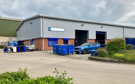 The unit comprises of a modern warehouse with concrete floor and brickwork walls to 2 metres, with steel profile sheet cladding above. The property is accessed via two electric roller shutter doors and has the benefit of an integral office with WC fa...