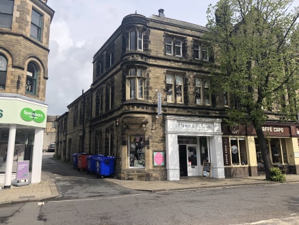 The premises comprise a corner unit in an attractive stone fronted terrace and include a well appointed ground floor sales shop. The unit enjoys the benefit of an attractive double entrance with display glazing, as well as window frontage to the spla...