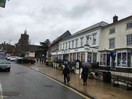 The property comprises an attractive, double fronted shop beneath a pitched slate covered roof offering extensive ground floor, mezzanine and first floor open plan sales areas.

The accommodation benefits from carpeting, fluorescent lighting, storage...