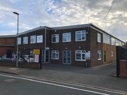 6,939 sq ft industrial unit with office accommodation. Main reception with showroom and kitchen, stairs leading up to the offices. Yard space to the rear.