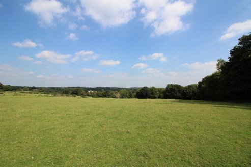 A parcel of gently sloping, predominantly south-east facing agricultural land divided into hedge and fence enclosed pasture fields with a small woodland shaw. Lane Frontage - mains water - no public footpaths. In all about 43.5 acres (17.6 ha).