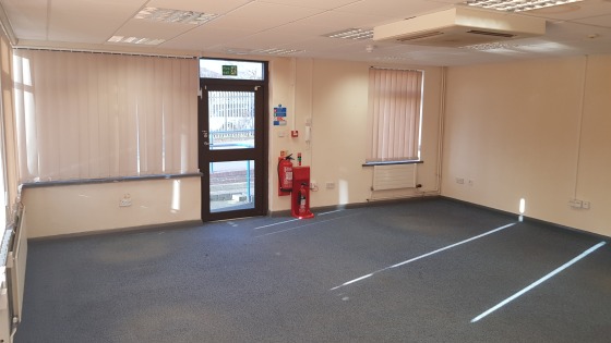 The property includes a large yard area which is shared in part with the adjacent occupier. Approximately 2,264.49 sq. m. (0.559 acres) of yard is available excluding parking.

In the main the property comprises brick built offices with flat roof wit...
