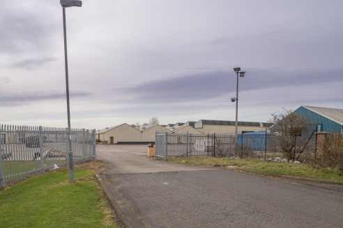 The property comprises a substantial industrial facility with extensive yard and parking areas, and adjoining offices. To the rear there is a further area of compound and/or development land. The building has been subdivided to provide a number of in...