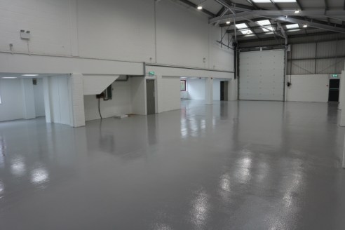 Industrial / Warehouse with a large loading door, good height with open plan first floor office and parking.