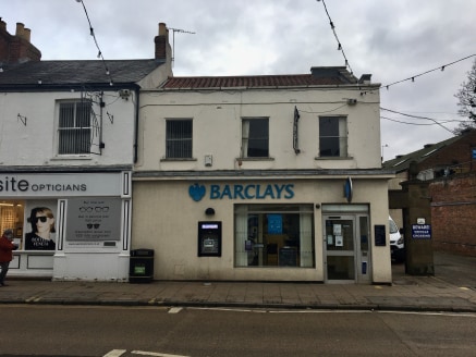 The property comprises a two storey former banking premises assumed to be of traditional masonry construction with a painted concrete render, under a pitched roof with concerete interlocking tile covering. There is a single storey brick built extensi...