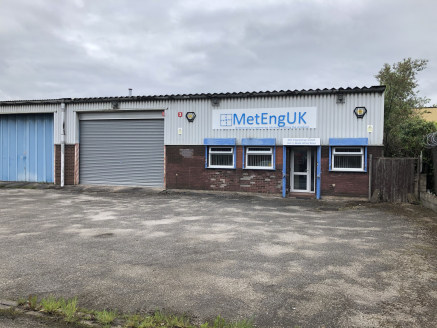 The property comprises a warehouse unit of steel portal frame construction with part brick, part blockwork, part steel clad elevations beneath a pitched asbestos sheet roof. Internally the unit has been predominantly fitted out as offices and split i...