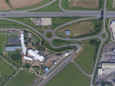 Two irregular shaped broadly level sites fronting the entrance to the Snetterton Park complex each benefiting from vehicular access from roundabout access immediately off the A11 trunk road.