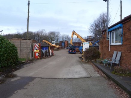 The site is rectangular in shape, being set back from Clough Street and accessed via a secure gated entrance. A road which widens to incorporate car parking and a weighbridge leads to the main site, which is currently operated as a scrap metal recycl...