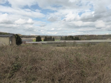 The site is of an irregular shape and comprises a roughly grassed parcel of land which slopes in a south to north direction towards the Cromford Canal (disused). It is understood that there is a foul water sewer which crosses a section of the site. T...