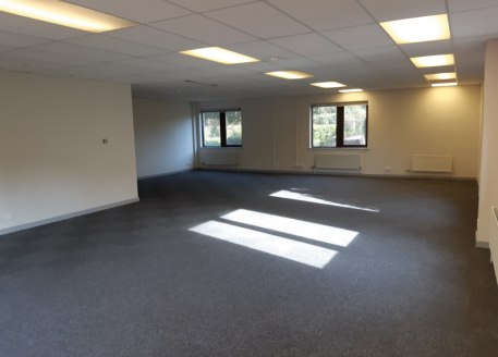 The property comprises ground and first floors of an end of terrace office building, with parking to the front and rear. The property is accessed via it's own dedicated front door leading to a ground floor lobby, and in turn WC's, ground floor open p...