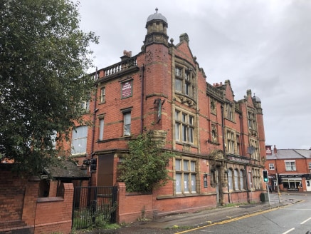 The property comprises a three storey Grade II listed period property formerly used as a public house/hotel together with a plot of land to the rear formerly used as a bowling green together with car parking. 

The site has a total area of approx. 1...