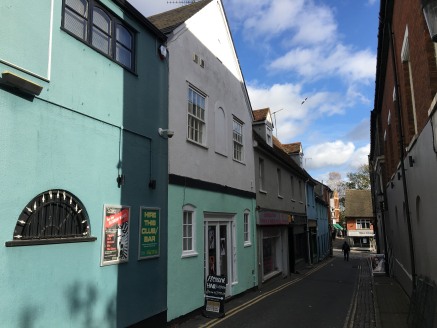 The properties are terraced and are of two storey traditional construction beneath pitched tiled and corrugated asbestos roofs.