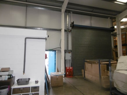 The estate provides a range of modern industrial units with onsite parking. Unit 12-13C has 2 roller shutter entrances and is fitted with lighting, a single office and WC. Internal eaves to the underside of the stanchions is 5.3m (17'3”) with a max h...