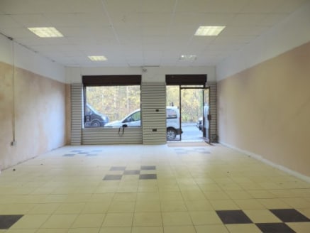 A modern mid-parade retail unit on the outskirts of Colne town centre.\n\nThe property is open plan internally with a suspended ceiling and is plastered throughout.\n\nThe shop unit is rectangular in shape with security shutters to the main doors and...