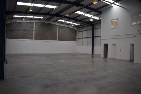 The premises comprise a terraced self-contained modern industrial unit. Externally they have car parking to their frontage with a secure shared service yard area to the rear. Access to the warehouse area is via an up and over electrically operated ro...