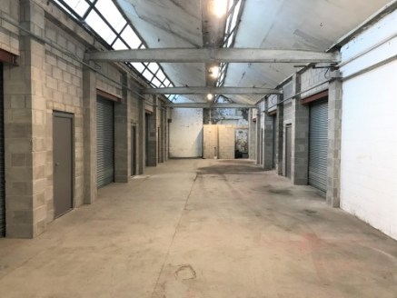 A series of self-contained workshop/storage units positioned close to junction 10 of the M65 motorway.\n\nThe lockup units are of blockwork construction with an open plan layout with good natural light, concrete floors and are suitable for various us...