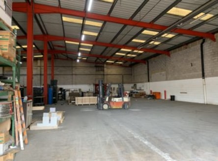 The property comprises a steel portal framed workshop with brick and block lower walls with profile steel cladding above, and concrete floor.<br><br>There is an electronically operated up and over door to the front elevation providing vehicular acces...