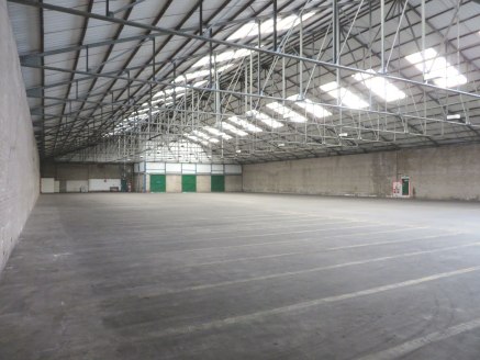 Semi-detached industrial warehouse facility with covered loading bay and level loading facilities at both ends of building.<br><br>Eaves 5.4m<br><br>Offices and ancillary facilities provided.<br><br>New FRI lease on terms to be agreed.<br><br>Terms:...