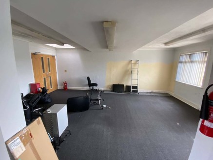 The premises is currently set up as an financial service offices on the ground floor with storage, kitchenette, and WC facilities to the rear with associated storage, WC, and a meeting room on the first. There is an outside area to the rear with park...