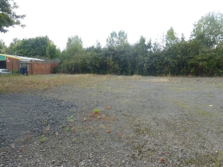 The site benefits from block paving to the front (left) and a gravelled area to the right which could be utilised for various uses. The main yard area to the rear benefit from perimeter fencing, a security...