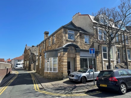 The property comprises the ground floor of a two storey end terrace period property, that is constructed of stonework elevations under pitched and slated roof slopes. 

The upper floor has been sold off on a 99 year lease from 2008 and is used for re...