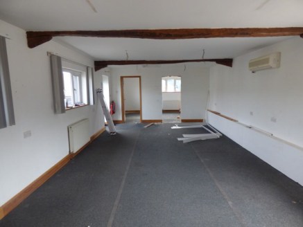 HIGH END CHARACTER BARN CONVERSION with exposed beams and lots of natural light. In a scenic location this office includes underfloor heating, air conditioning, alarm, carpeted floors, high speed broadband and loads of parking. The office has a store...