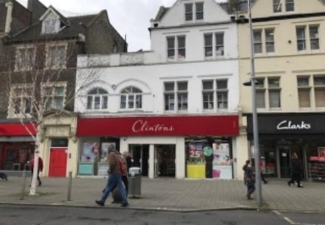 A double fronted shop with upper floors and basement.