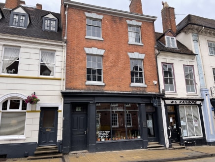 Attractive Grade II Listed period building, retail at ground and first floors, ancillary accommodation with basement, second and third floors.