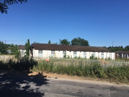 The property, at the moment, is a former workshop space. The roller shutter doors have been removed. The building could be tidied up quite easily and made usable.

The buildings in general are fairly basic concrete structures with pitched asbestos ce...