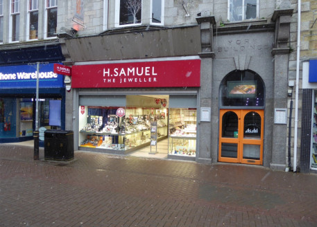 Ground floor lock-up shop in prime retail area. Retail area 1,203 sq ft (111.8 sq m). Currently fitted out as a jewellers to include rear staff area, store room, small office area and toilets....