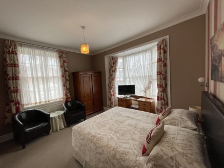 Town centre former hotel, 14 bedrooms and ancillary lounge, bar, dining room, kitchen, potential manager's accommodation, utility rooms, and on site car parking.