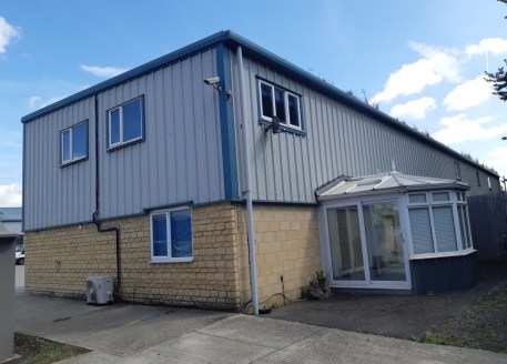 An end of terrace unit of steel portal frame construction with double glazed windows. Suspended ceilings with recessed lighting, wall mounted air conditioning/cooling units. Carpeted throughout. High speed broadband. Ground floor comprises main offic...