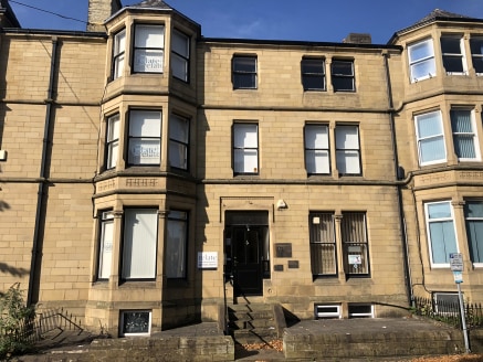 The property is a large and characterful period building situated prominently in a parade of similar properties on Clare Road, a mixed commercial and residential street in the centre of Halifax. 

The premises has been divided into secure offices sui...