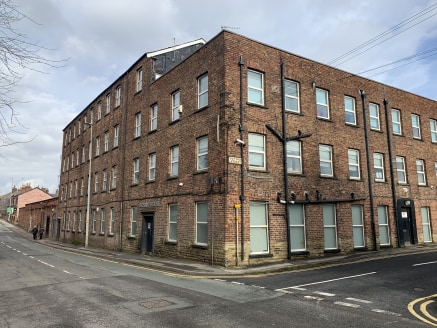 Oxford House comprises a brick built former mill building with lower ground floor level industrial/workshop premises to the rear on a site of approx. 0.86 acres. The offices (formerly occupied by HFS Loans, Capital One and The Quint Group) are arrang...