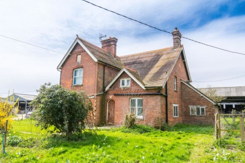 Residential smallholding with a Victorian farmhouse, pasture, woodland and an agricultural outbuilding. In all about 10.4 acres.