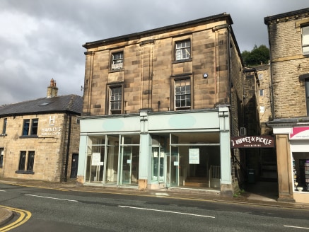 The premises comprise the ground floor and first floor of an atractive stone building. The ground floor accommodation provides retail space in two sections, with glazed display windows, laminate flooring and spot lighting. To the first floor is a sec...